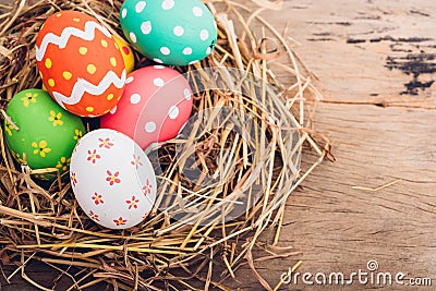 Beautiful Easter multi color egg in straw Stock Photo