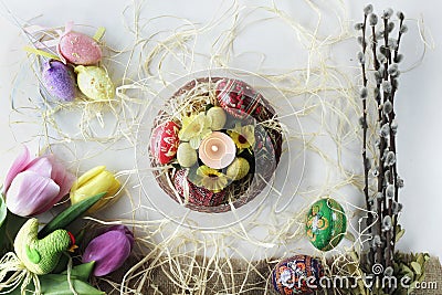 Beautiful Eastern style flat lay with traditional painted eggs and tulips Stock Photo