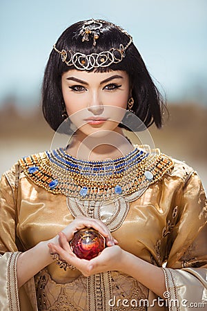 Beautiful Egyptian woman like Cleopatra outdoor Stock Photo