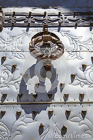 Beautiful elaborated doorknocker of San Bartolome church in Javea Stock Photo