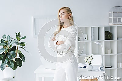 beautiful elegant businesswoman in white clothes in modern light Stock Photo