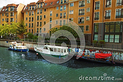 Beautiful elegant houses on the embankment, river, ships. City summer landscape. Editorial Stock Photo