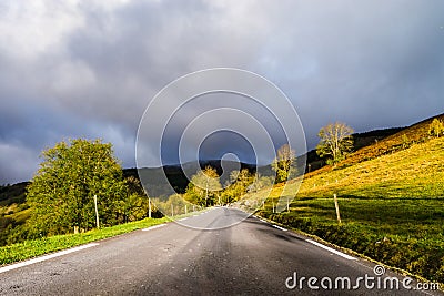 Beautiful empty road in Pyrenees. Autumn sunrise, shadows and co Stock Photo