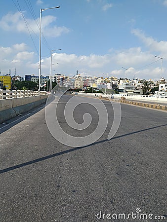 Beautiful Empty Road view of Dr Raj Kumar Samadi Road. Due to Lock down very less vehicle moving near Nandini Layout and Laggere Editorial Stock Photo