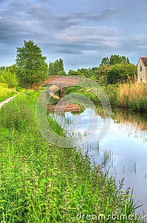 Beautiful English canal and bridge on calm still day in colourful HDR Stock Photo