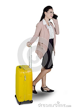 Beautiful entrepreneur with phone and suitcase Stock Photo