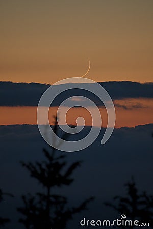 Beautiful evening centered view of crescent Moon seen from Ticknock Forest National Park, County Dublin, Ireland Stock Photo