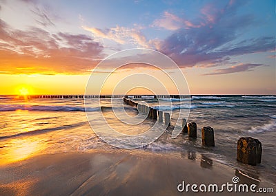 Beautiful evening sky over the sea and the beach at sunset Stock Photo