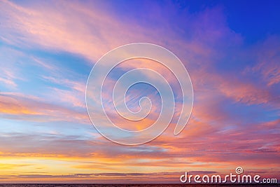 Beautiful evening sky with pink clouds. Sunset over the sea Stock Photo