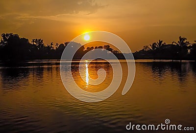 Beautiful evening sunset with water Stock Photo