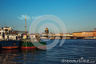 Beautiful evening sunset, visible ships in the port on the Neva river, evening promenade. St. Petersburg, Russia. Vasilievsky isla Editorial Stock Photo