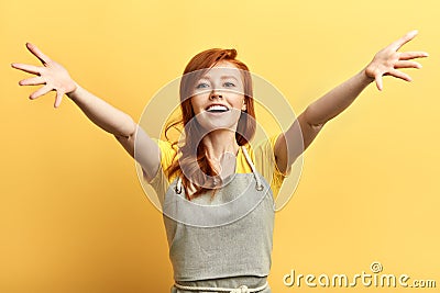 Beautiful excited happy woman open arms for hug looking at the camera . Stock Photo