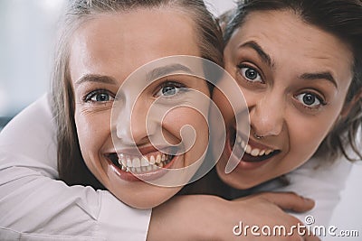 Beautiful excited homosexual couple embracing and smiling Stock Photo