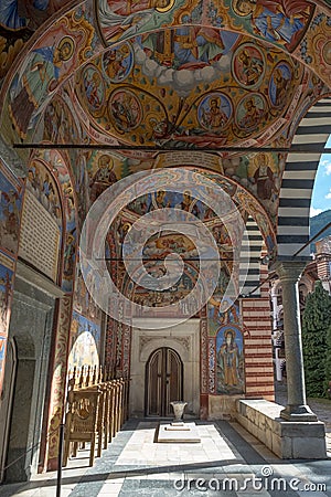 Walkway around main church decorated with frescoes, Rila Monastery, Bulgaria Editorial Stock Photo