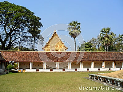 Beautiful facade of Wat That Luang Nua buddhist temple as seen from PhaThat Luang stupa in Vientiane, Laos Stock Photo