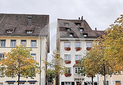 Beautiful facades of historic houses at the old town of Swiss City of Schaffhausen on a foggy winter day. Stock Photo