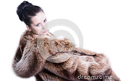 Pretty woman in luxury winter fur coat Stock Photo