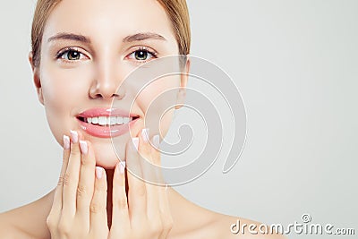 Beautiful face with pink glossy lips and manicured hands with french manicure nails, closeup portrait Stock Photo