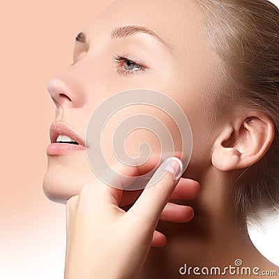 Beautiful face of young adult woman with clean fresh skin - . Beautiful girl with beautiful makeup, youth and skin care Stock Photo