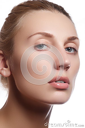 Beautiful face of young adult woman with clean fresh skin - isolated. Beautiful girl with beautiful makeup, youth and skin care co Stock Photo