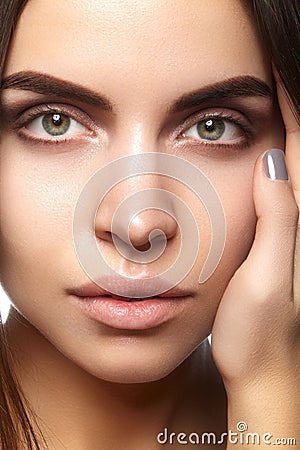 Beautiful face of young woman. Skincare, wellness, spa. Clean soft skin, healthy fresh look. Natural daily makeup Stock Photo