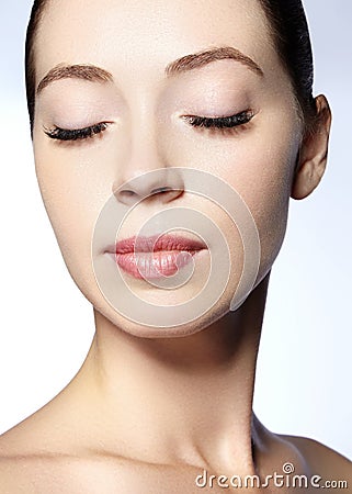 Beautiful face of young woman. Skincare, wellness, spa. Clean soft skin, healthy fresh look. Natural daily makeup Stock Photo