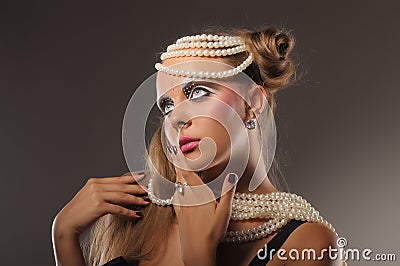 Beautiful fair-haired girl with pearl beads Stock Photo