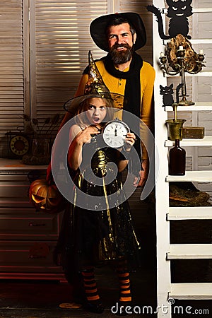 Beautiful fairy and wizard. Father and child celebrate halloween. Treat me like a fairy. Father and child have fun Stock Photo