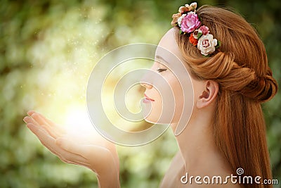 Beautiful fairy woman with glow in hands Stock Photo