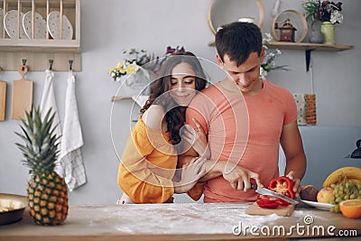 Beautiful family prepare food in a kitchen Stock Photo