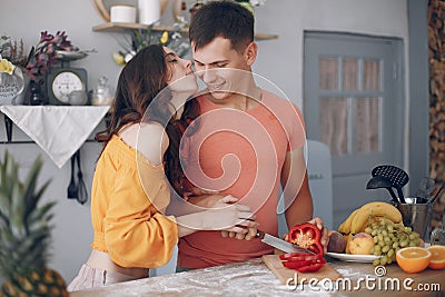 Beautiful family prepare food in a kitchen Stock Photo