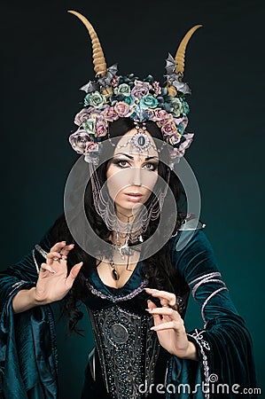 Beautiful fantasy elf woman in flower crown Stock Photo