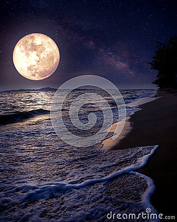 Beautiful fantasy tropical beach with Milky Way star in night skies, full moon Stock Photo