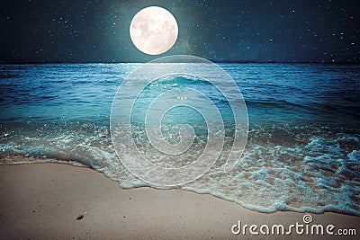 Beautiful fantasy tropical beach with star and full moon in night skies Stock Photo