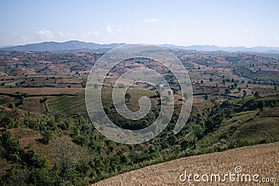 Rolling hills and farm lands with rice fields in Shan state, Myanmar Stock Photo