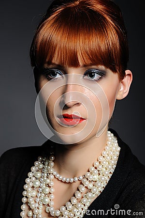 Beautiful fashion retro woman with pearl necklace Stock Photo