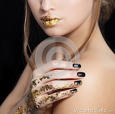 Beautiful Fashion woman model face portrait with gold lipstick and black nails. Glamour girl with bright makeup. Beauty Stock Photo