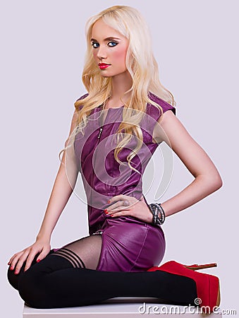 Beautiful fashionable blonde girl in dress Stock Photo