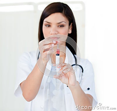 Beautiful female doctor preparing a syringe Stock Photo