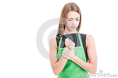 Beautiful female employee with wrist pain Stock Photo