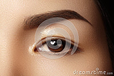 Beautiful female eye with clean skin, daily fashion makeup. Asian model face. Perfect shape of eyebrow Stock Photo