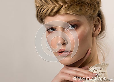 Beautiful female face close-up with a finger in the face. Stock Photo