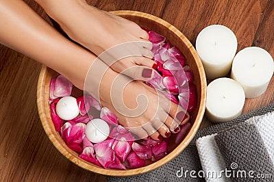 Beautiful female feet at spa salon on pedicure procedure. Stock Photo