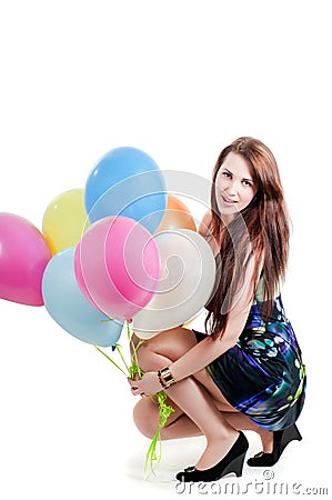 Beautiful female keeping multicolored air balloons Stock Photo