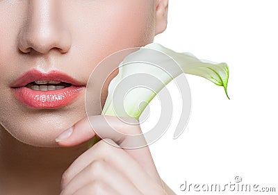 Beautiful female lips with natural color lipgloss and white lily calla flower isolated Stock Photo