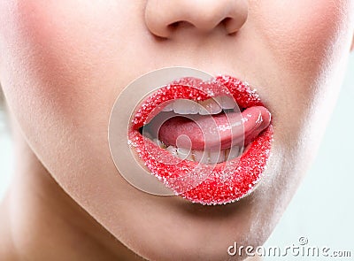 Beautiful female red lips, full with granulated sugar Stock Photo
