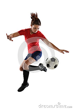 Female Soccer Player Kicking Ball Stock Photo