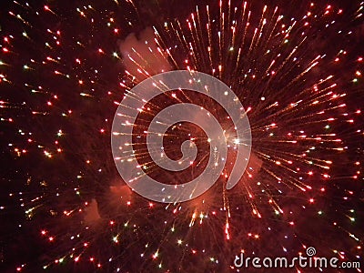 Beautiful fireworks dark night sky red light fire Stock Photo