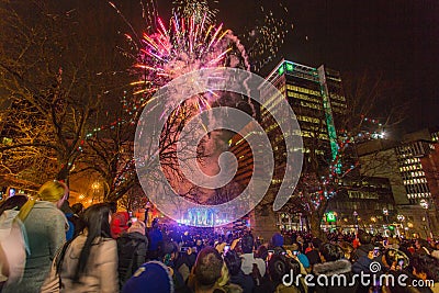 Halifax, Nova Scotia, Canada - Jan 1, 2020 - Beautiful fireworks Halifax City Hall with cheering background crowd. Editorial Stock Photo