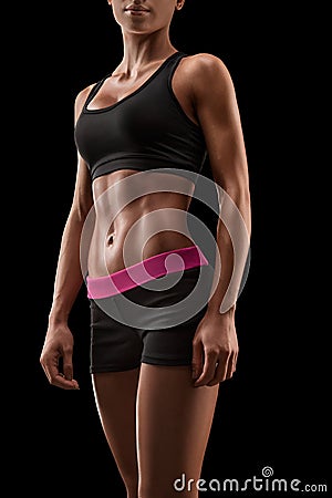 Beautiful fitness female slim tanned body Stock Photo